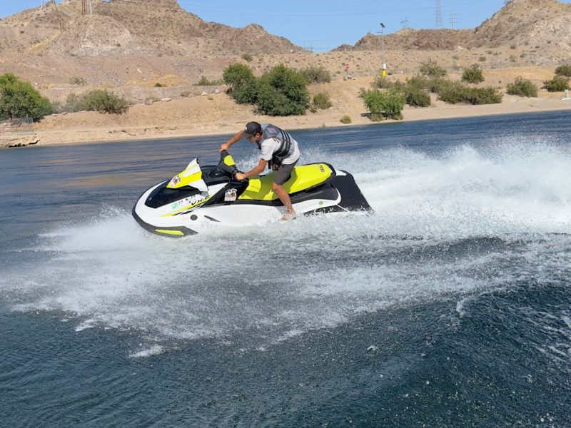 a man riding a wave on a surf board on a body of water