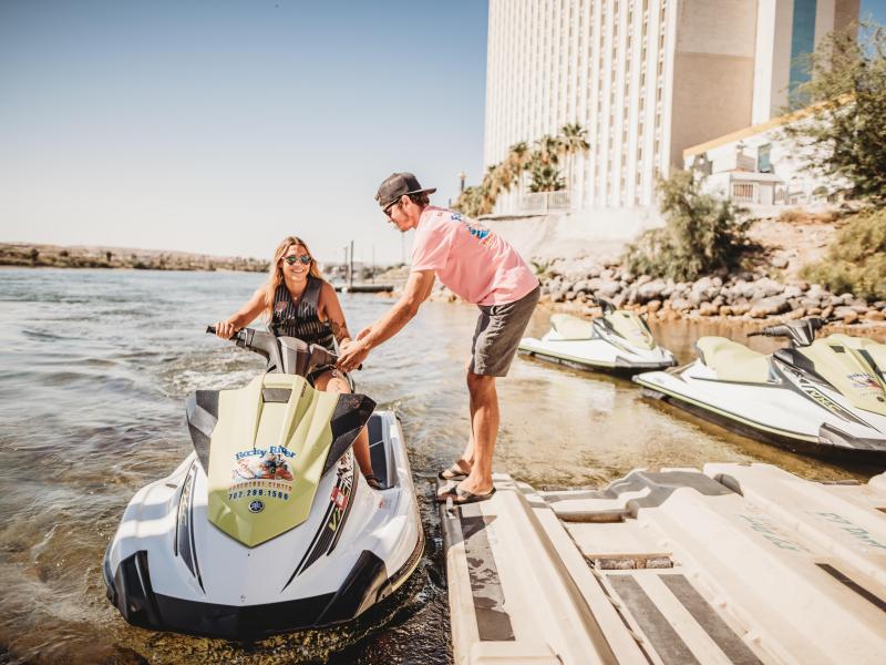 a man riding on the back of a boat